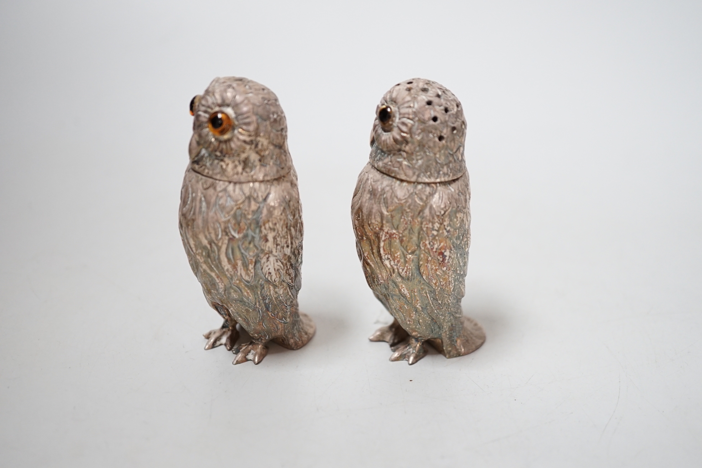 A pair of Queen Elizabeth II novelty silver owl pepperettes, makers DMS, London, 1972, 82mm.